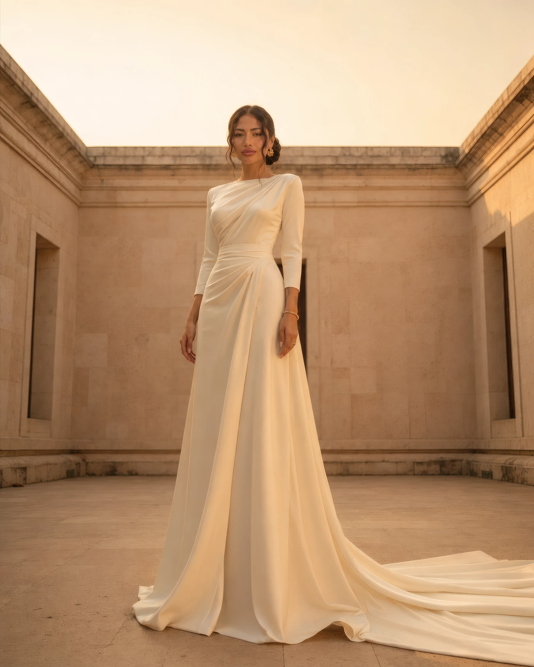 Maison YAYA — champagne silk gown with a sweeping train at golden hour